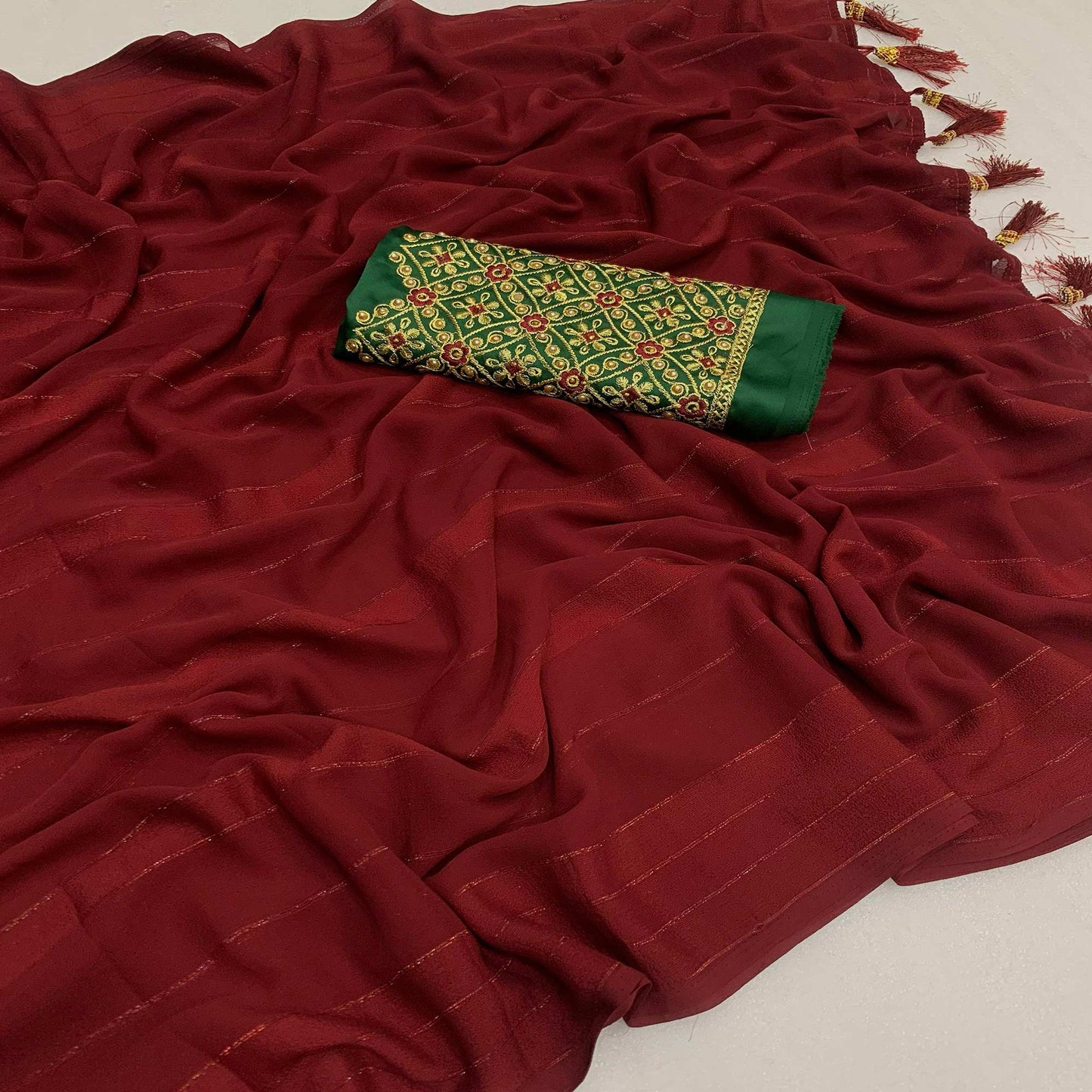 Maroon Zari Woven Georgettte Saree With Tassels