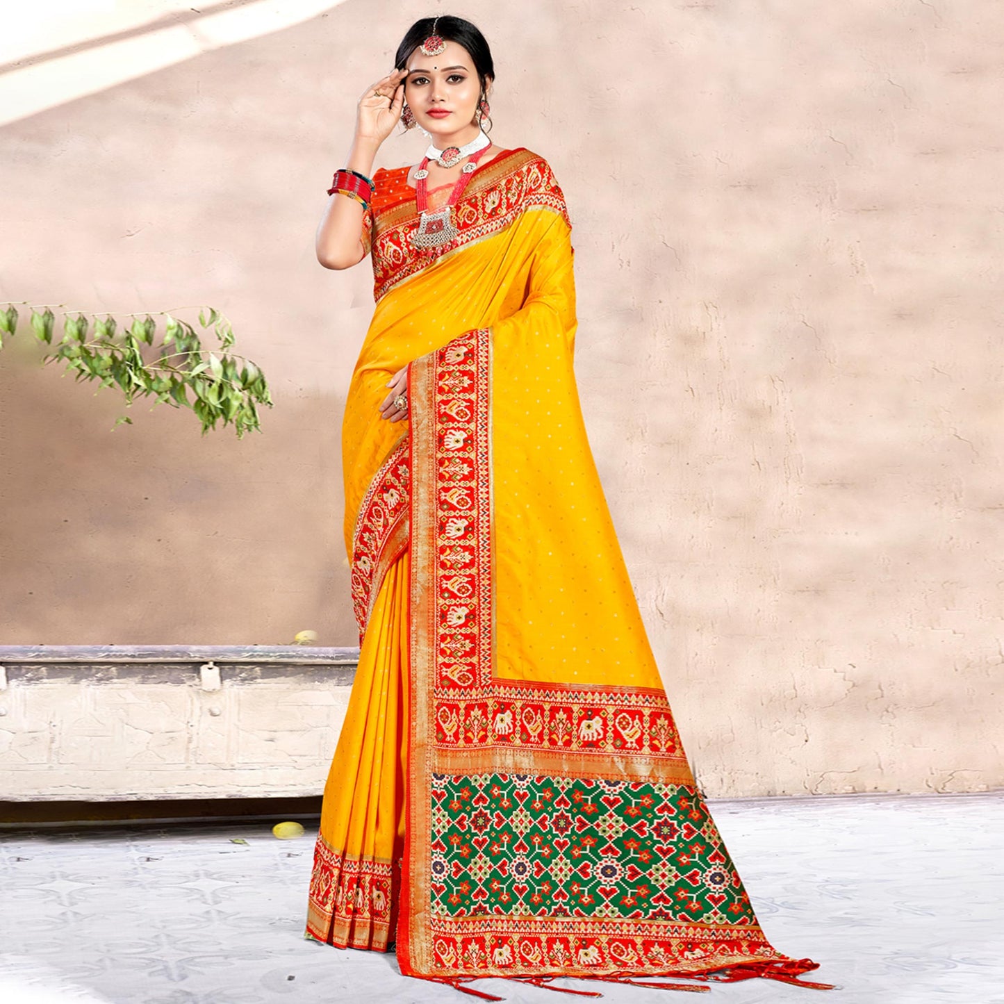 Yellow Woven Patola Banarasi Silk Saree With Tassels