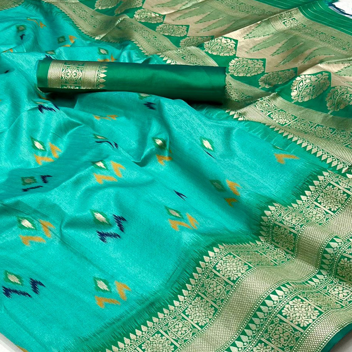 Turquoise Ikkat Handwoven Art Silk Saree With Tassels