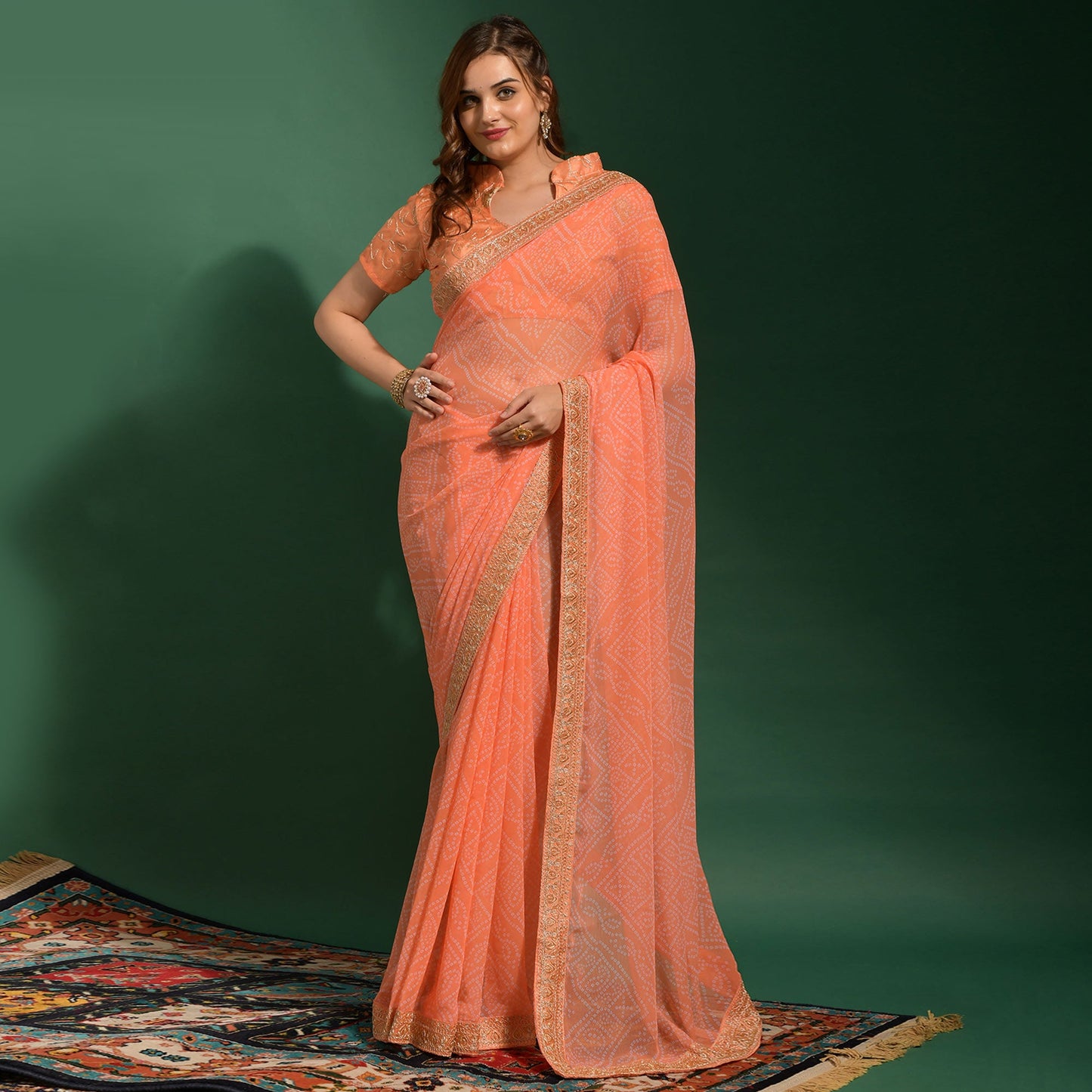 Peach Bandhani Printed Georgette Saree With Embroidered Border