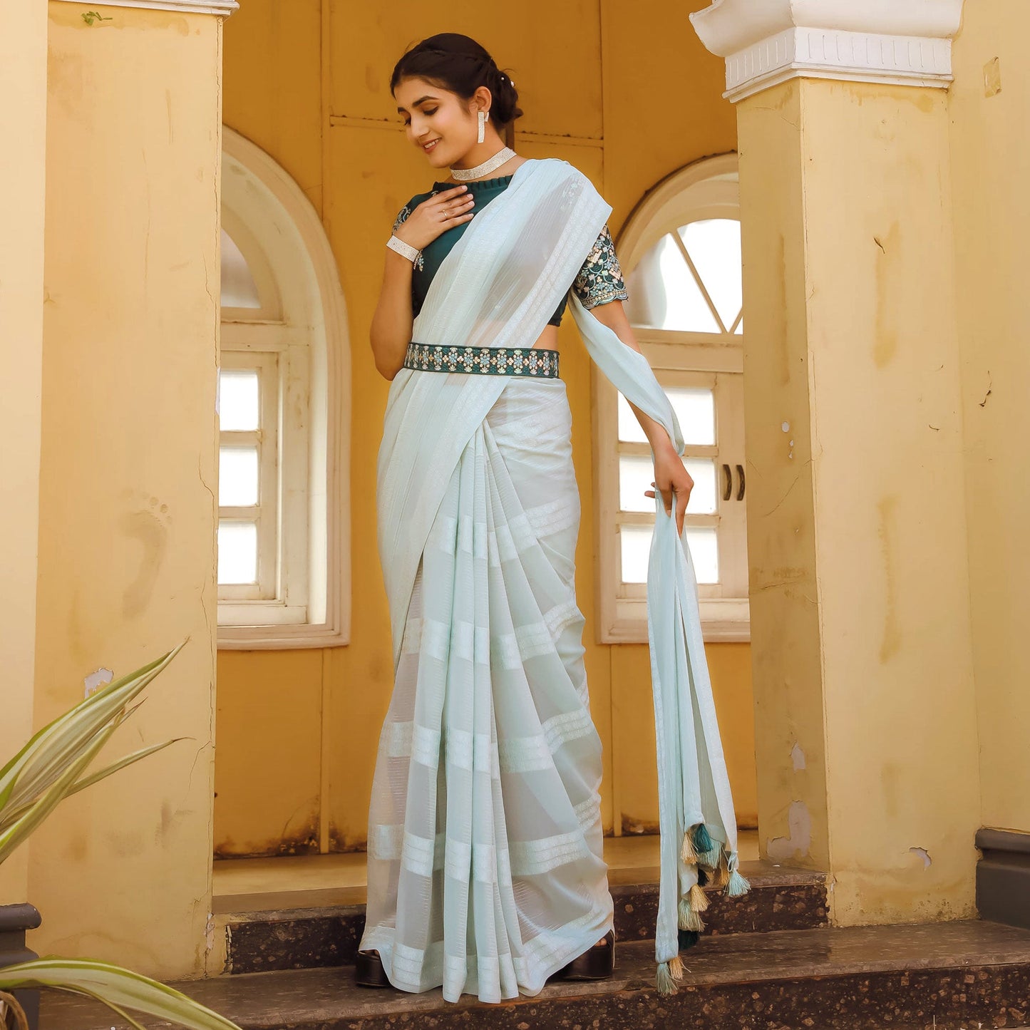 Light Blue Zari Woven Georgette Saree With Tassels