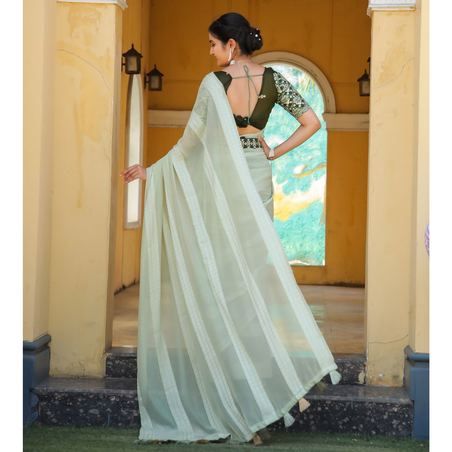 Light Green Zari Woven Georgette Saree With Tassels