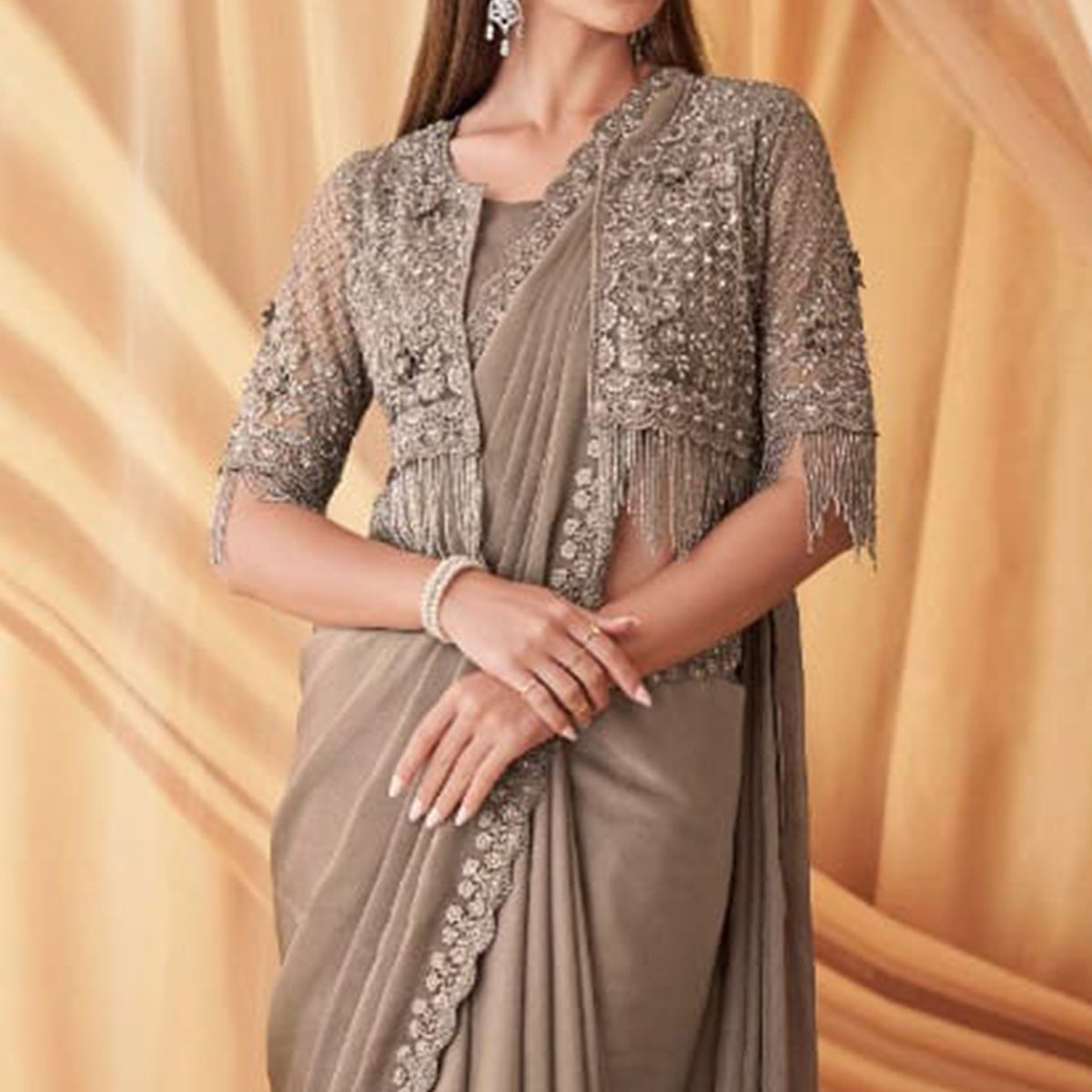 Beige Sequins Embroidered Georgette Saree With Tassels