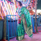 Turquoise Ikkat Handwoven Art Silk Saree With Tassels