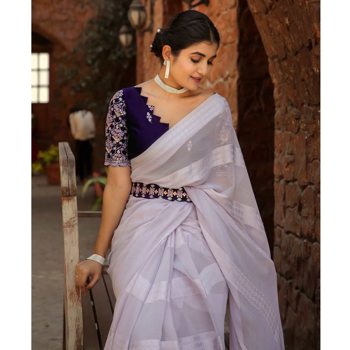 Light Lavender Zari Woven Georgette Saree With Tassels