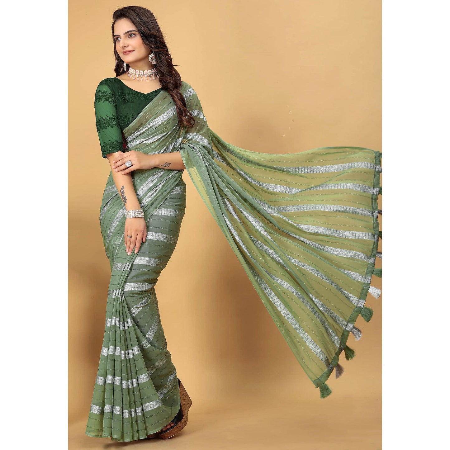 Green Zari Striped Georgette Saree With Tassels