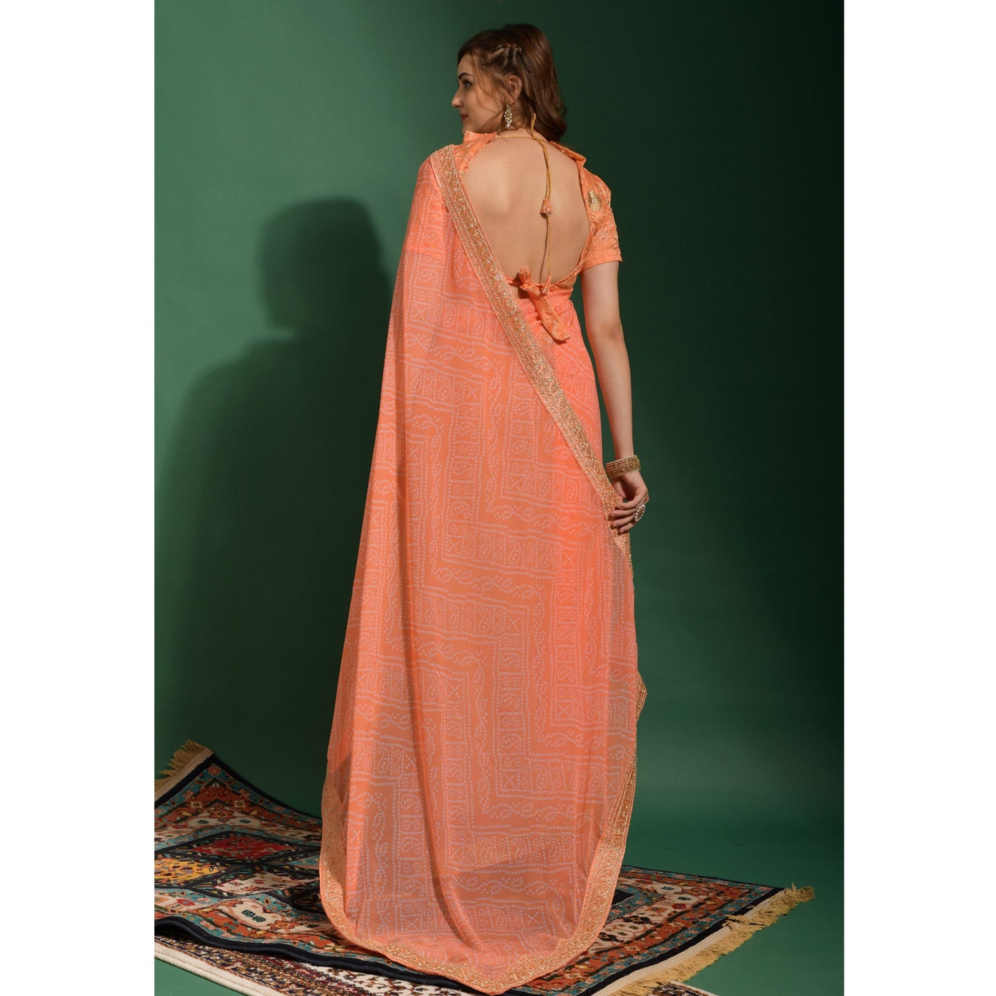 Peach Bandhani Printed Georgette Saree With Embroidered Border