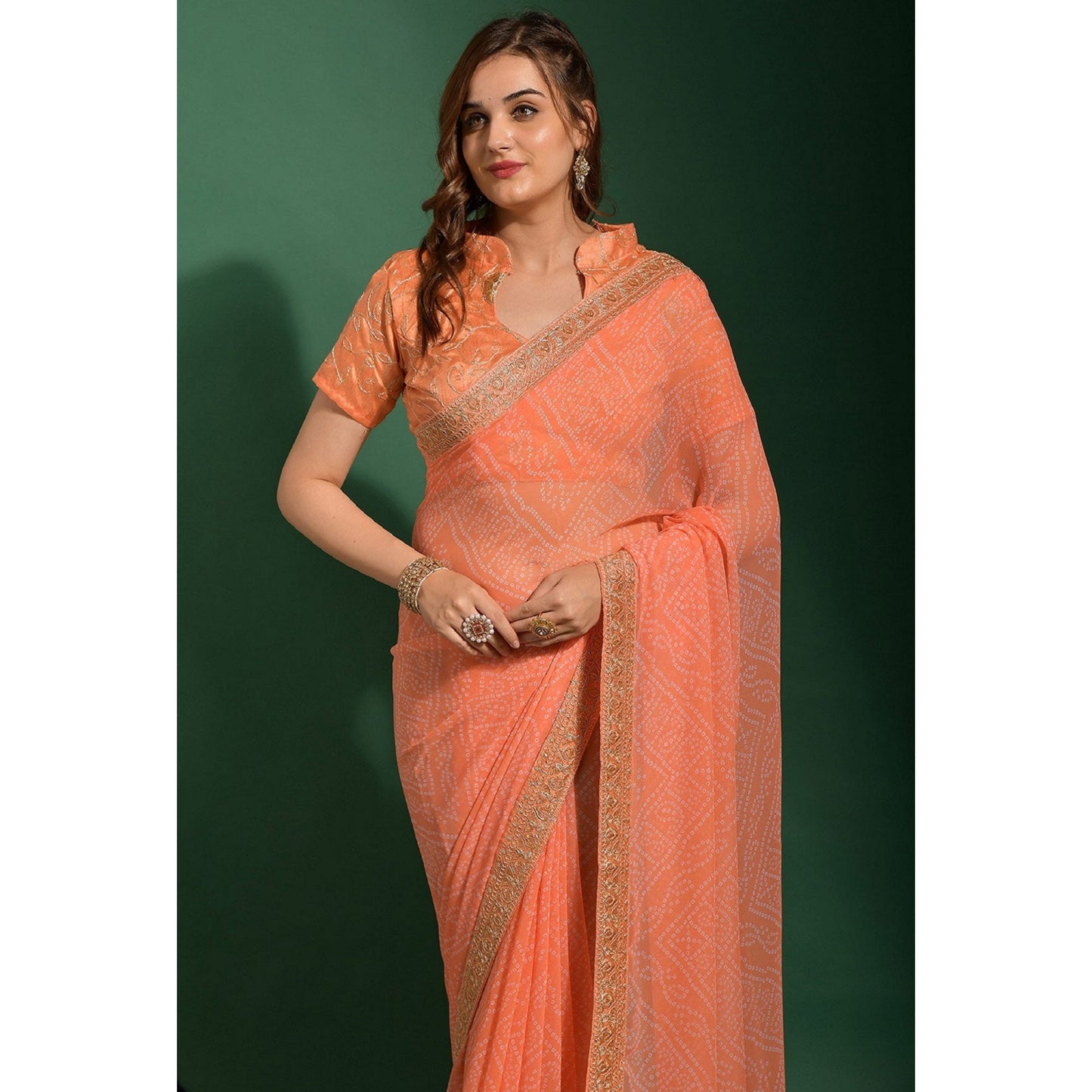 Peach Bandhani Printed Georgette Saree With Embroidered Border